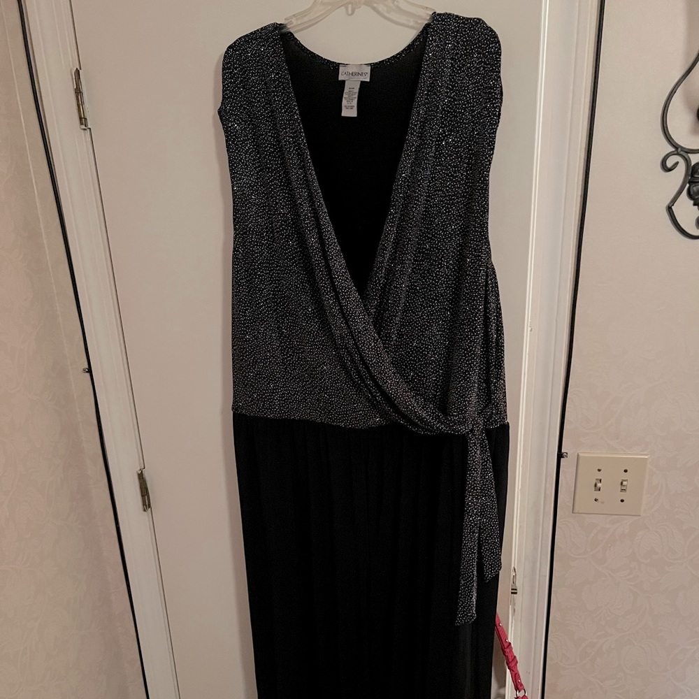 This is a silver and black romper. It has been worn once to an after 5 event.